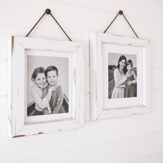 Farmhouse-style picture frames painted white with distressed edges